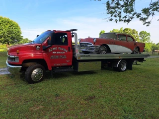 ACME Towing & Wrecker Services Tow Truck. Office hours 8-5 Mon.-Fri.