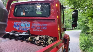 J&J AUTO TRANSPORTATION AND TOWING